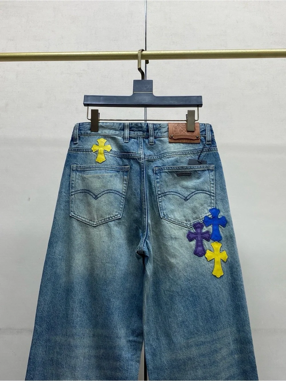 Chrome Hearts Blue Wide-Leg Jeans with Purple & Yellow Cross Appliqués